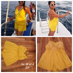 Yellow Polyester open back Romper. F21 size M